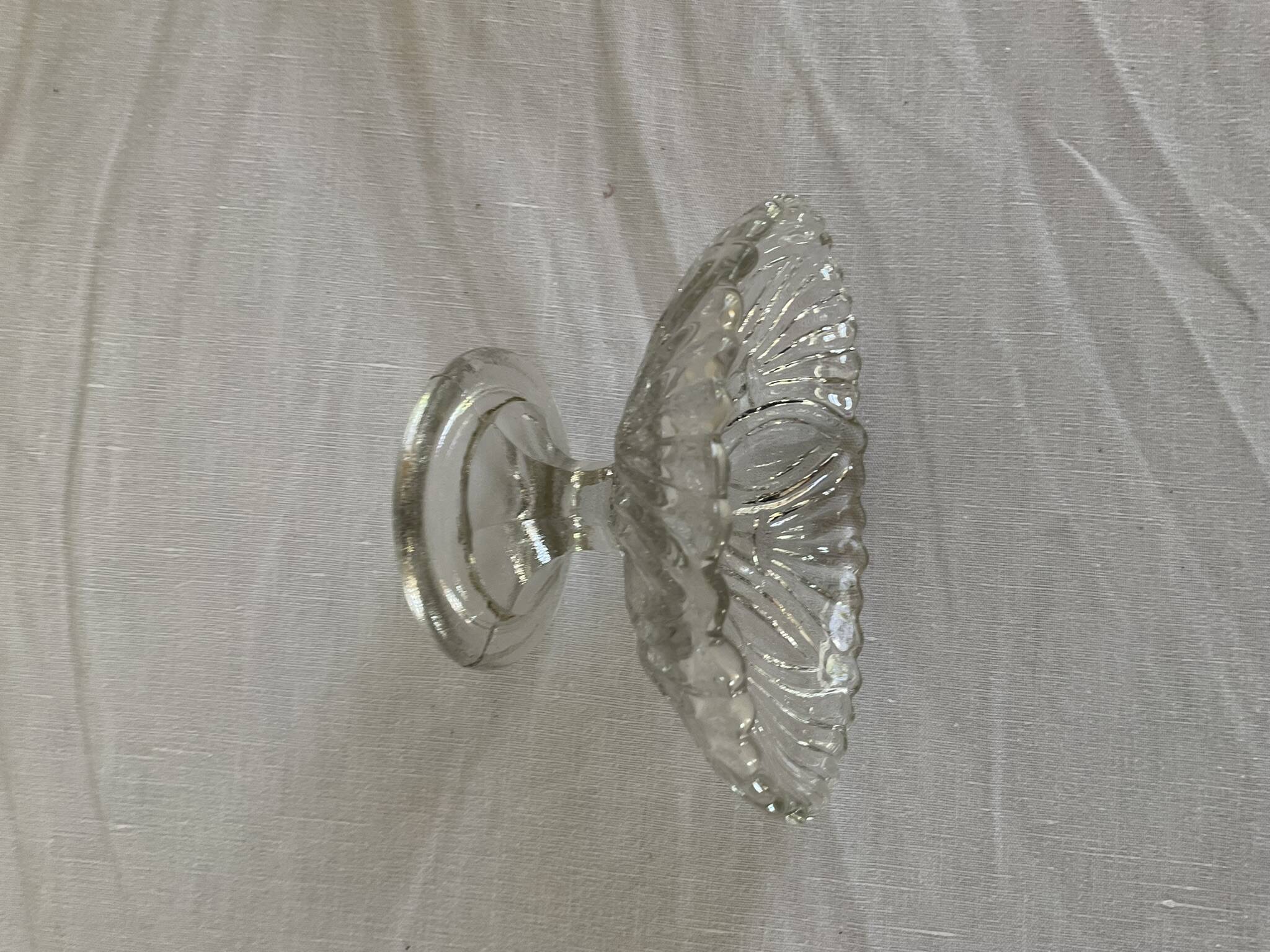 Small vintage footed bowl, made of clear moulded glass.