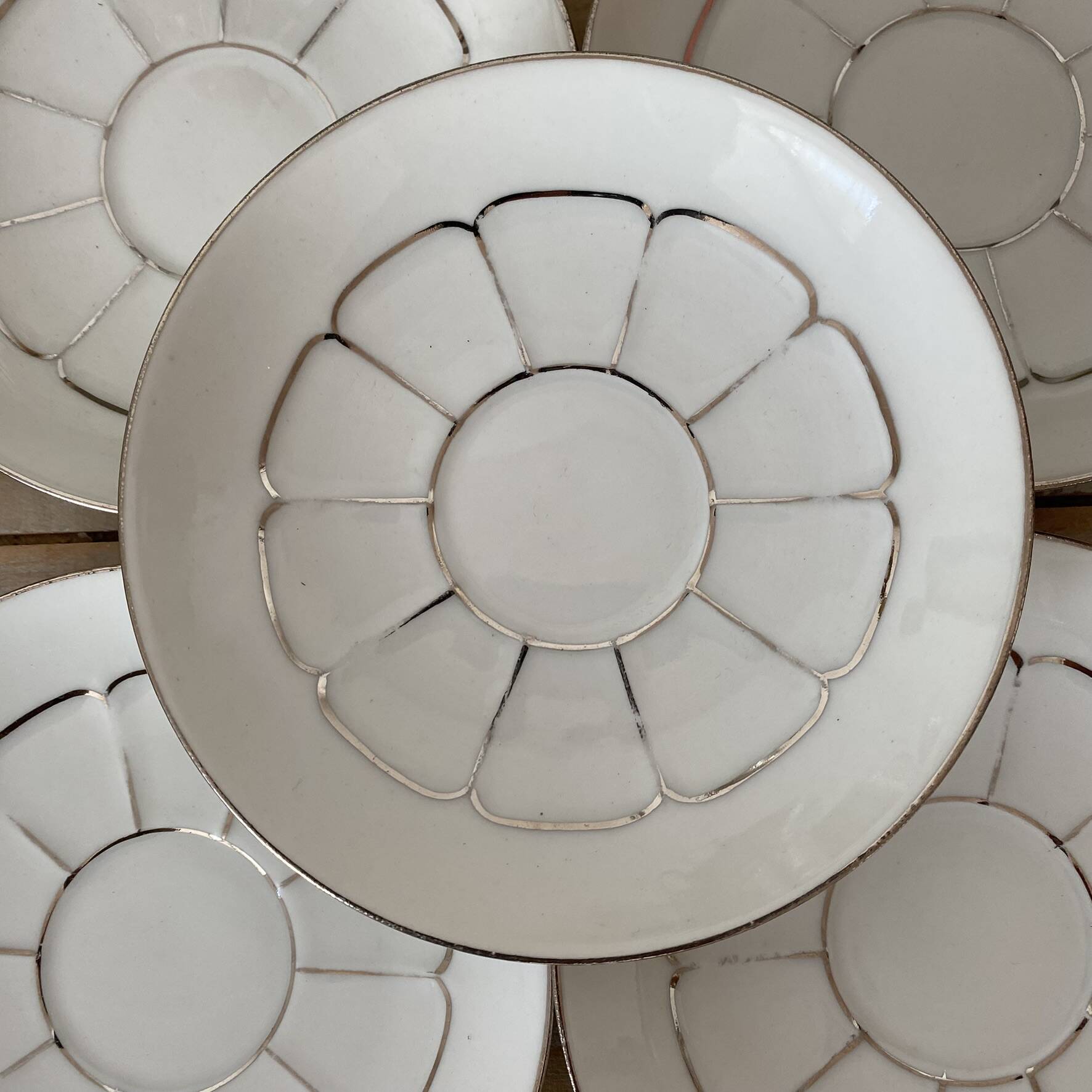 White and silver Limoges porcelain coffee cups and saucers.