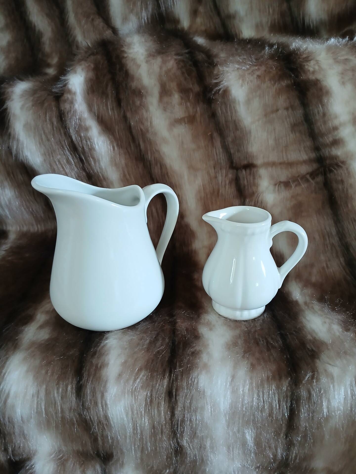2 antique pitchers in white earthenware