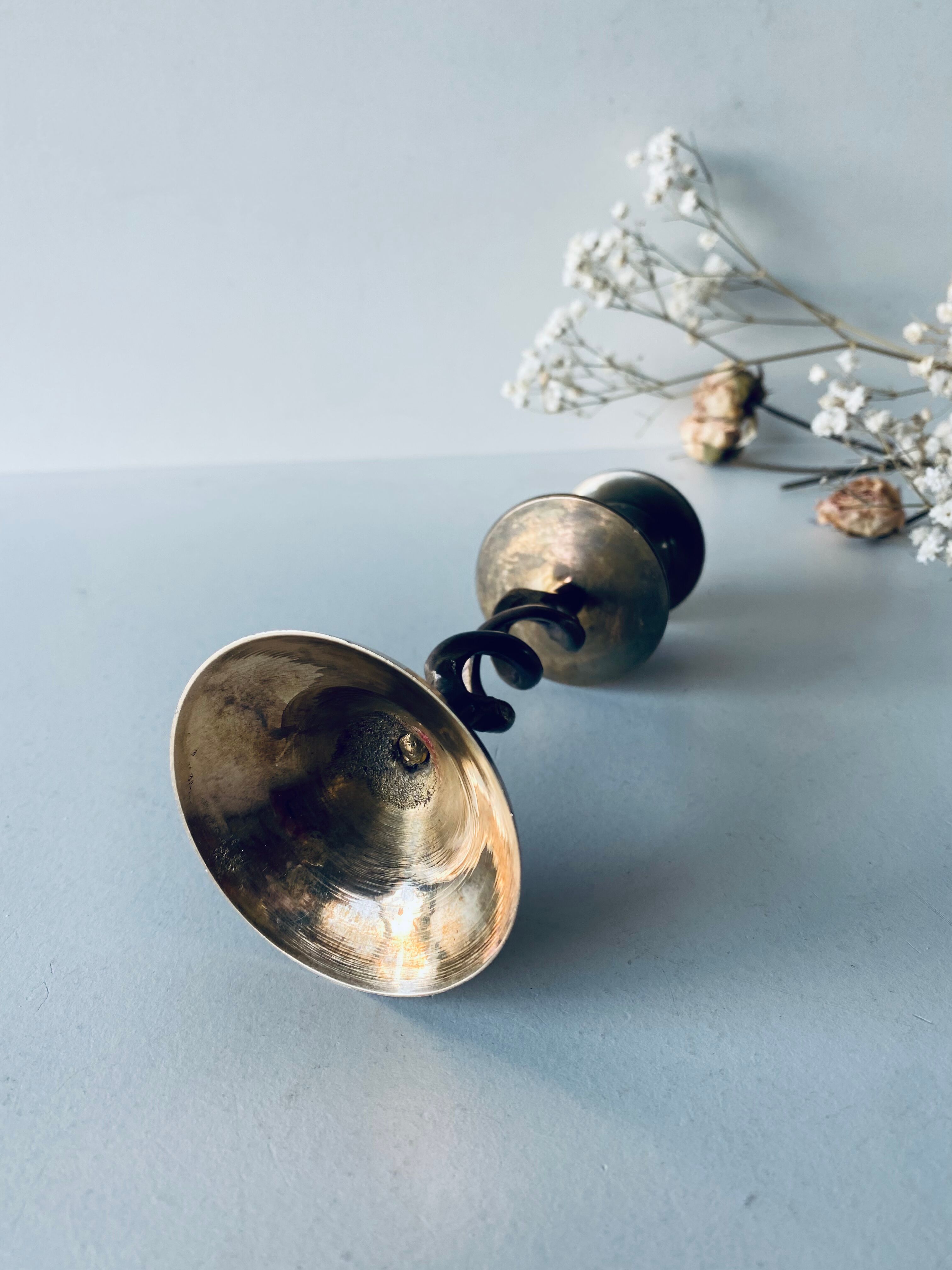 Twisted brass candle holder