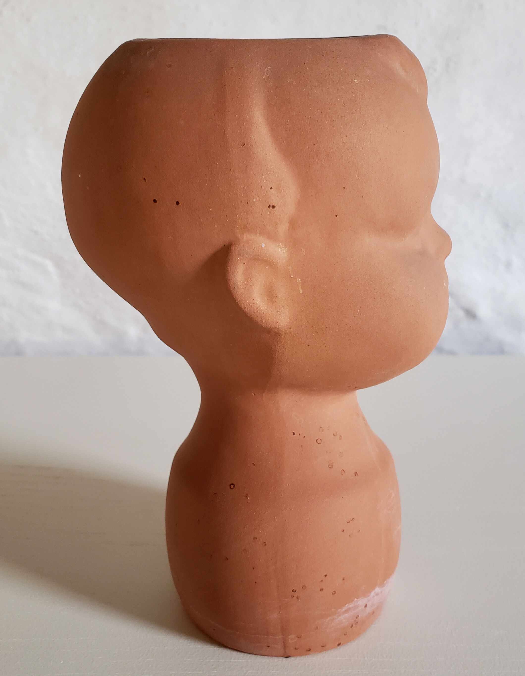 Terracotta pot cover baby head