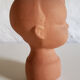 Terracotta pot cover baby head