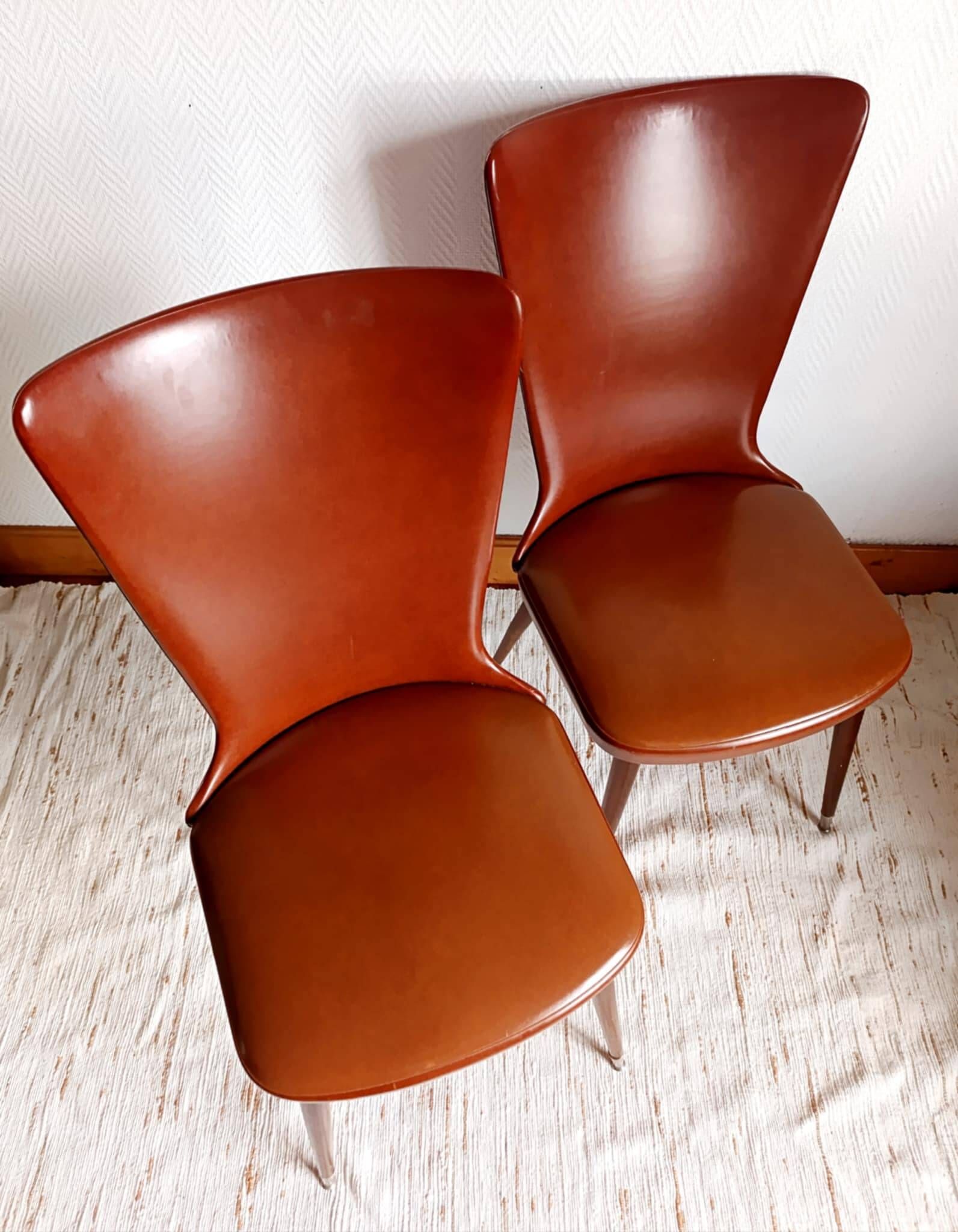 Pair of vintage vinyl chairs with splayed legs