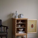 Scandinavian wardrobe in natural oak with a glass front.