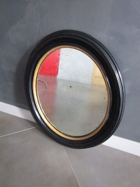 Miroir ovale bois noirci époque Napoléon III - 59x51cm