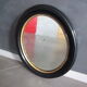 Miroir ovale bois noirci époque Napoléon III - 59x51cm