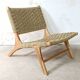 Pair of low armchairs in wood and woven rattan