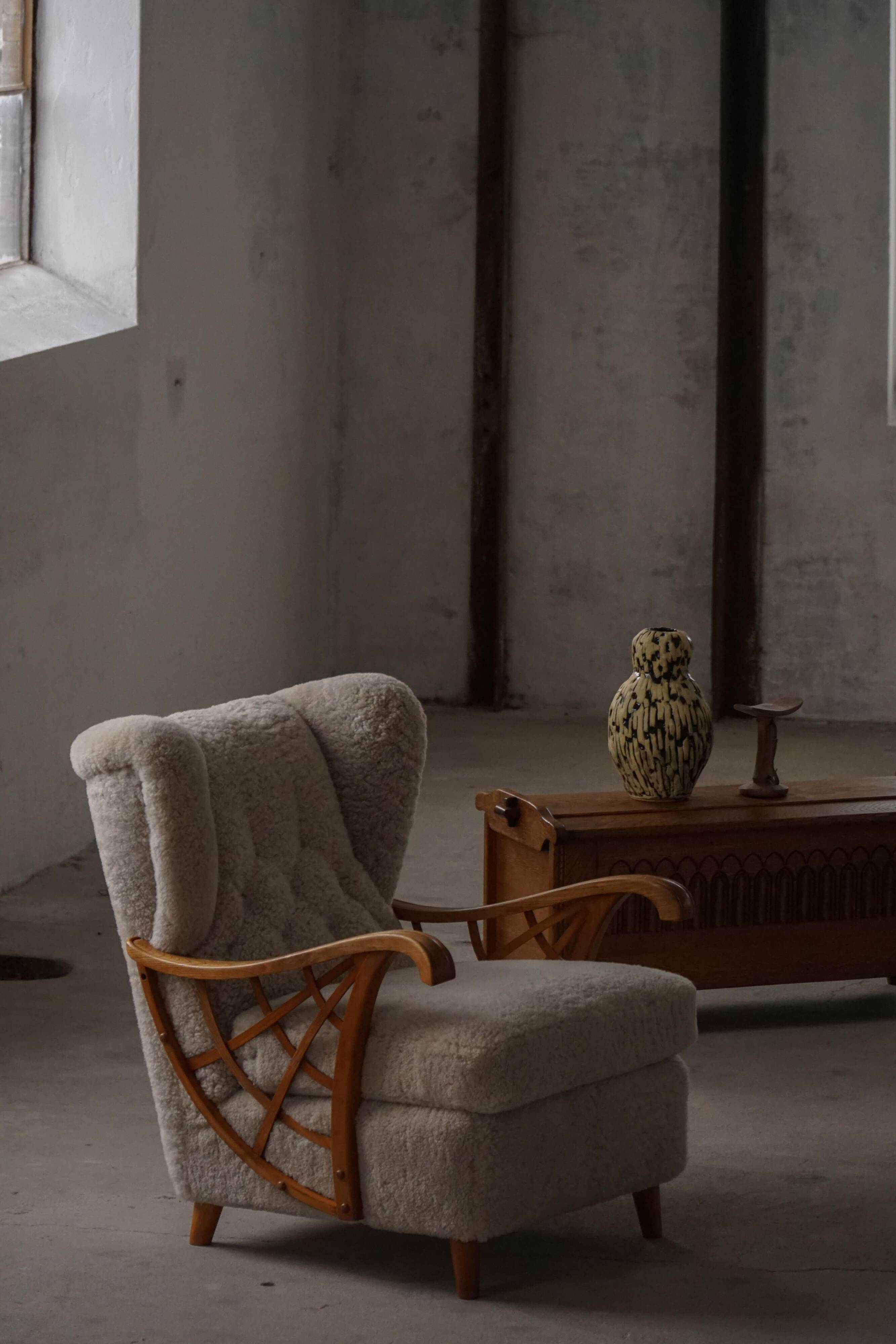 Pair of modern Swedish lounge chairs, shearling sheepskin and elm, 1940s.