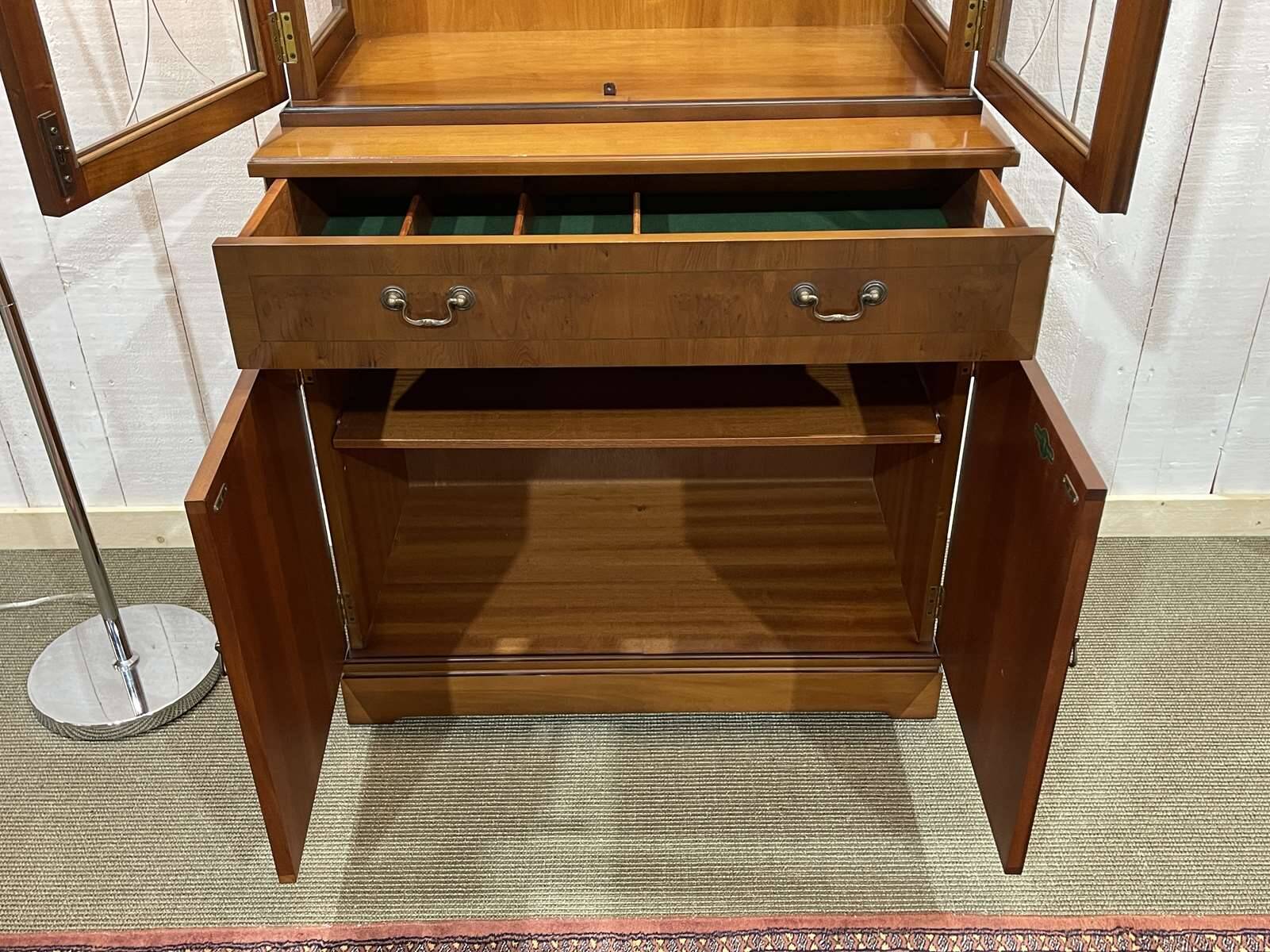 English display cabinet with two sections made of yew from the 1980s.