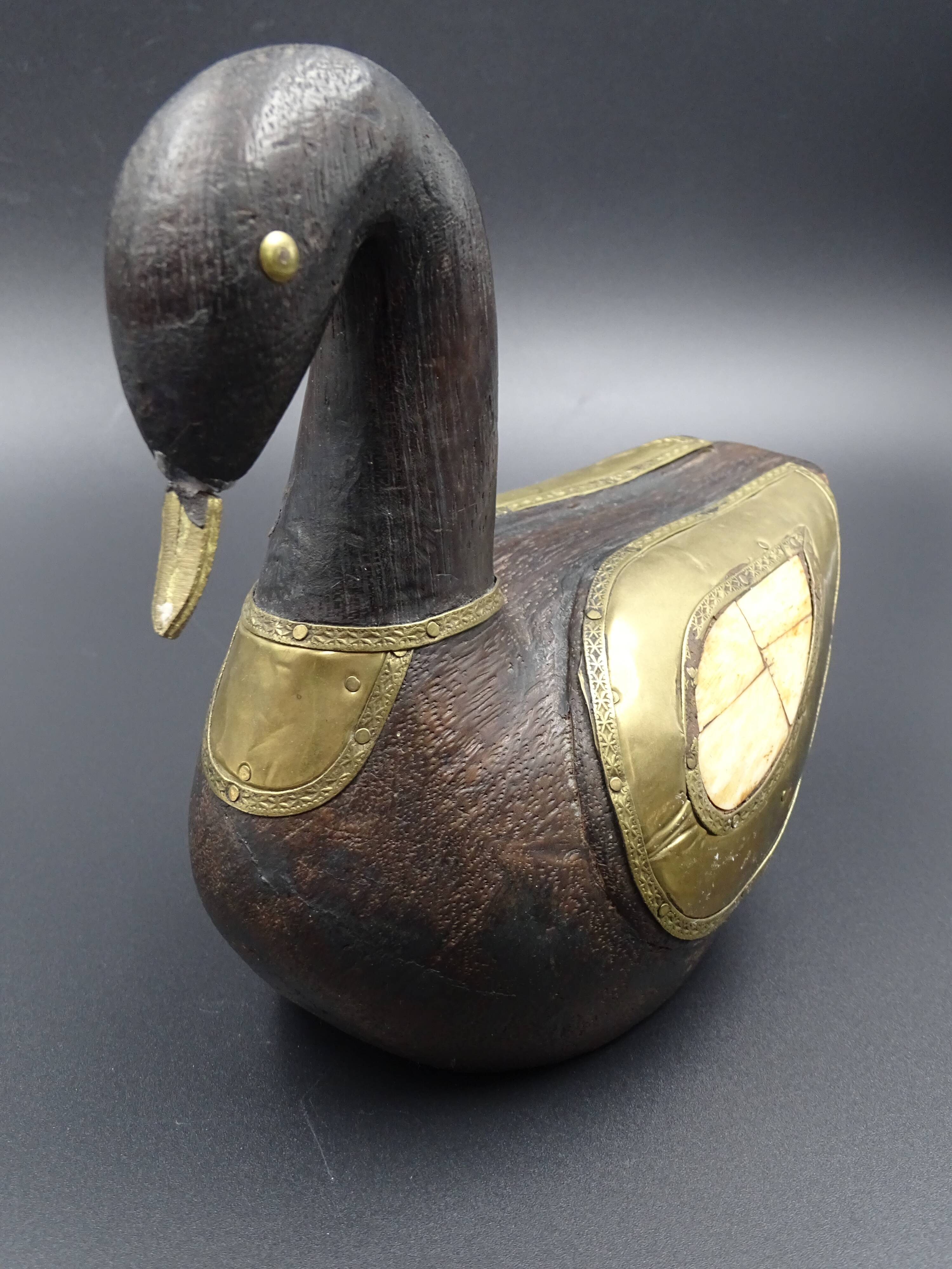 Wooden and brass swan