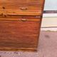 Vintage 1940s secretary desk with wooden curtains, storage, and shutters.