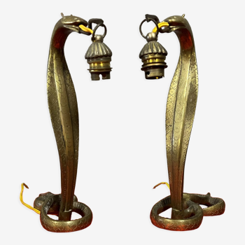Pair of cobra lamps in gilded bronze
