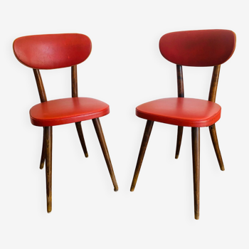 Pair of red Baumann chairs