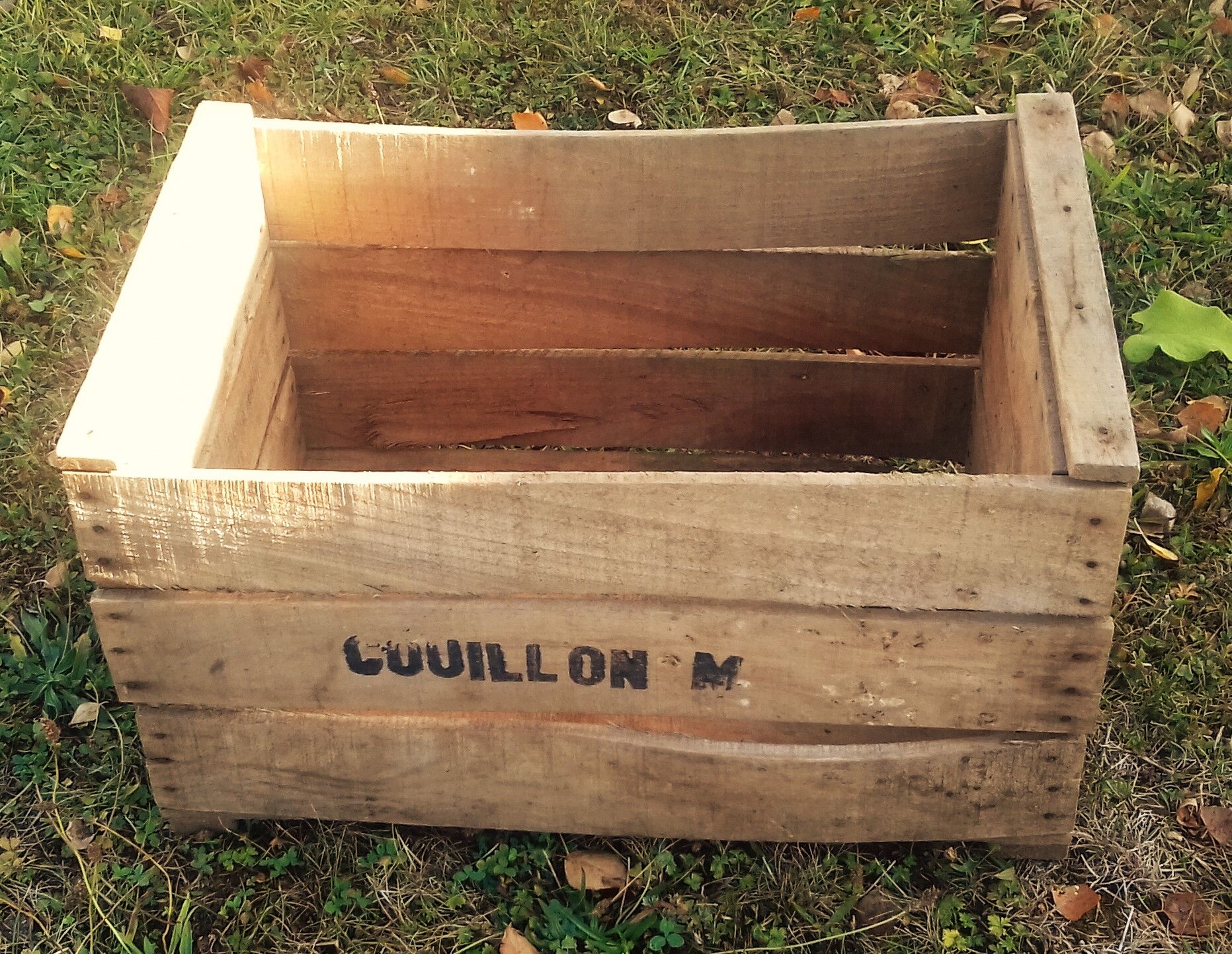 Wooden box with black letters