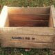 Wooden box with black letters