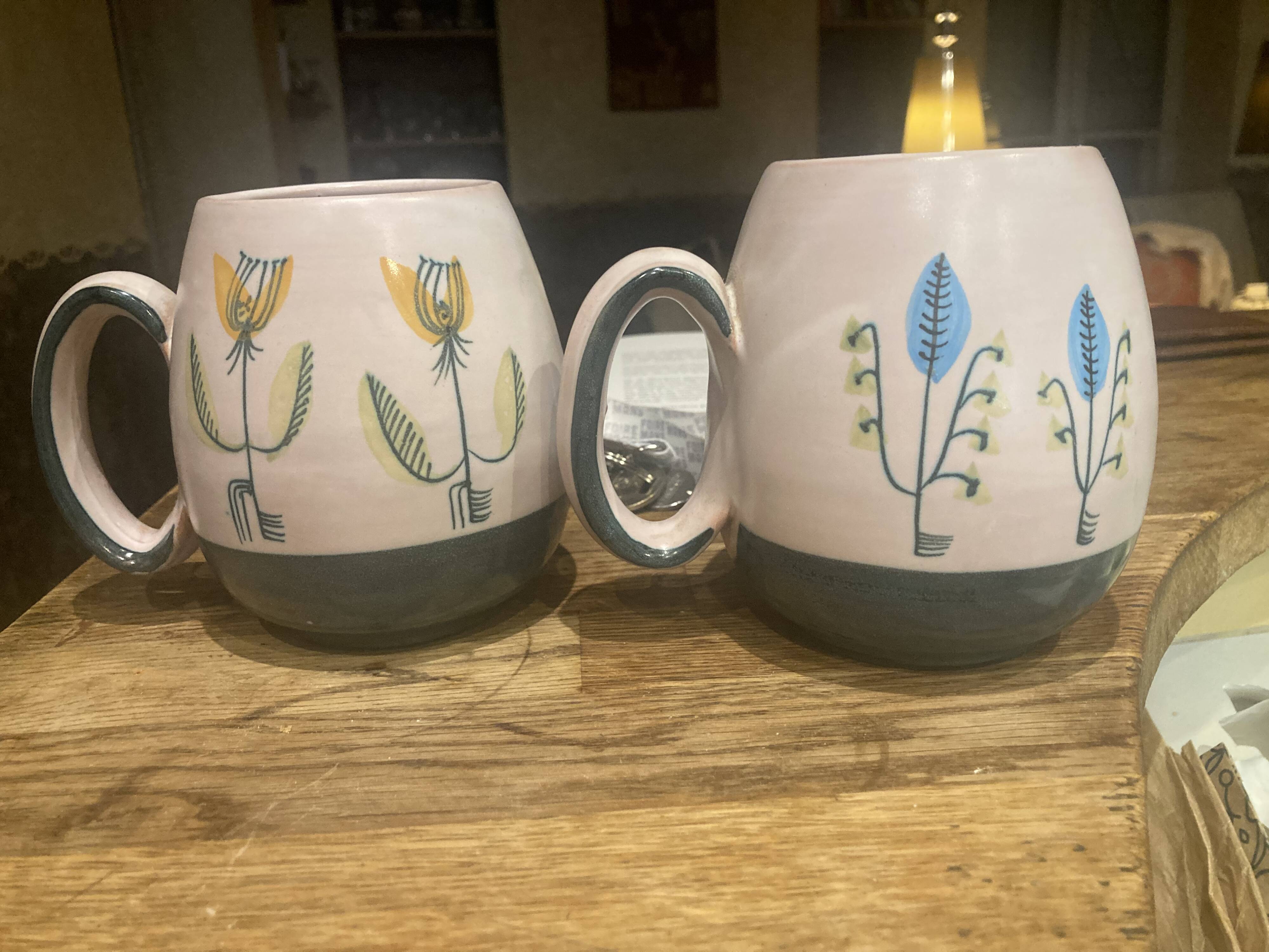 Set of two ceramic mugs signed Yvon ROY