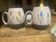 Set of two ceramic mugs signed Yvon ROY.