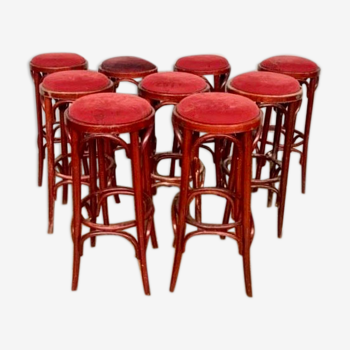 Series of 9 bistro bar stools in curved wooden restaurant sitting red fabric