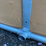 Vintage Italian industrial bench in leather and metal.