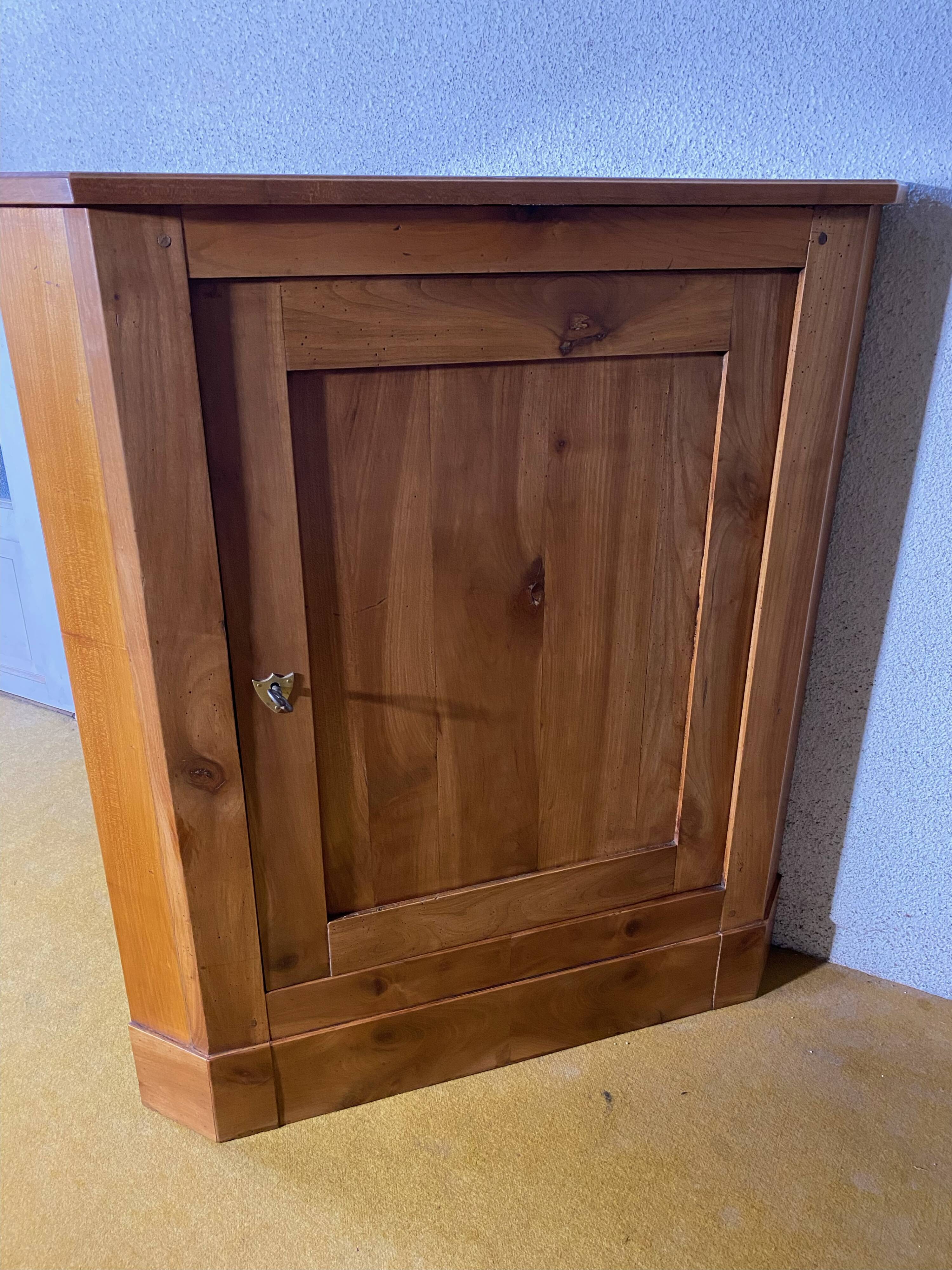 Cherry wood corner cupboard.