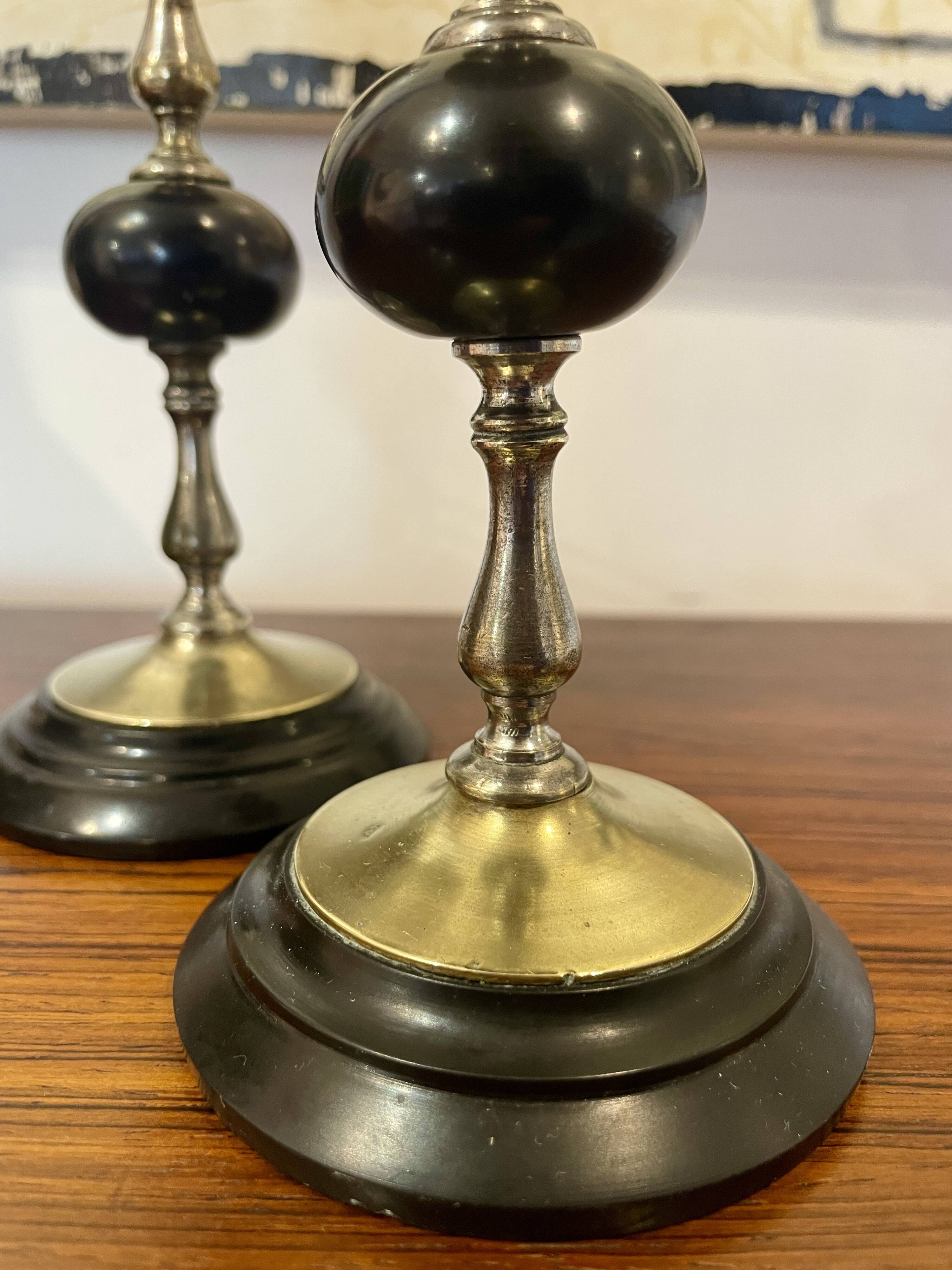 Pair of Napoleon III candlesticks in brass and black marble.