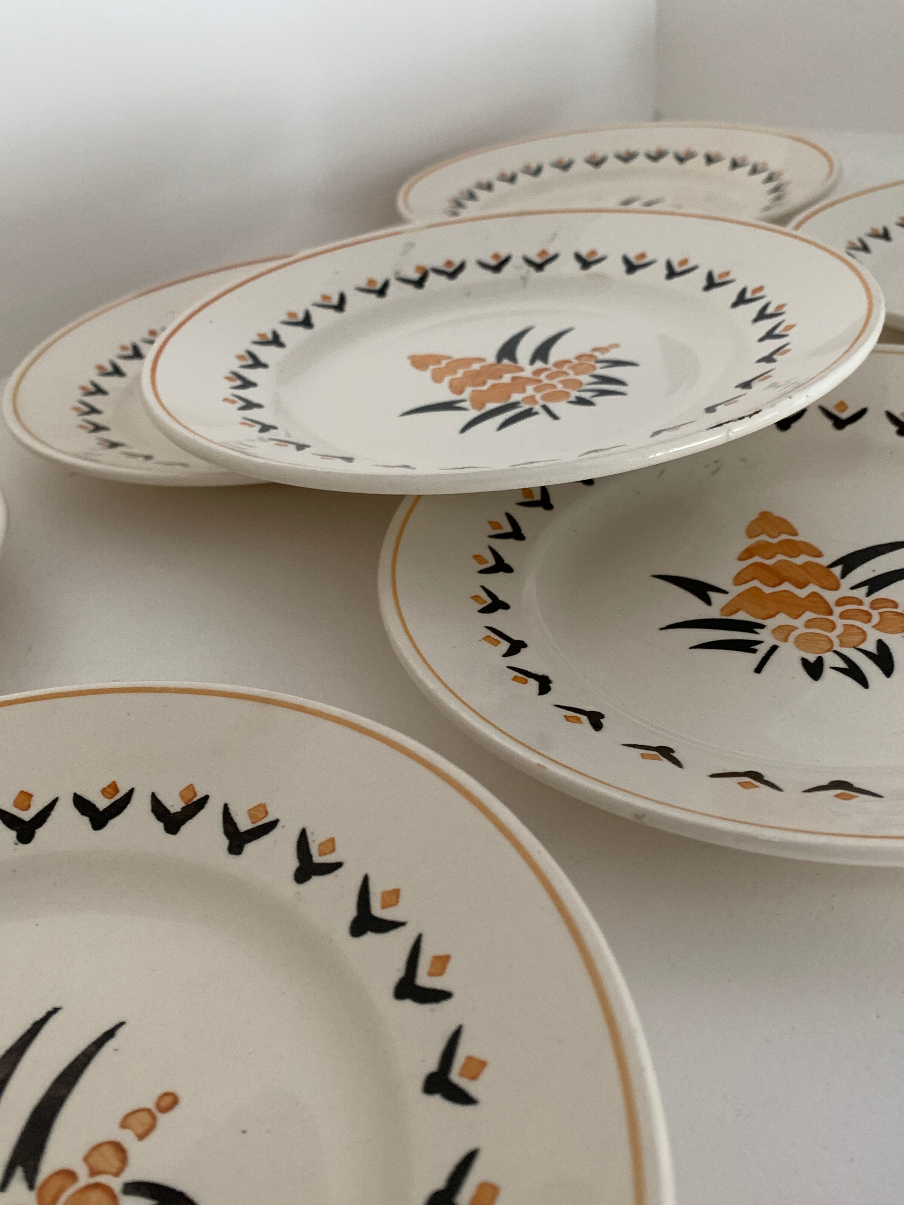 7 dessert plates and one Longwy dish