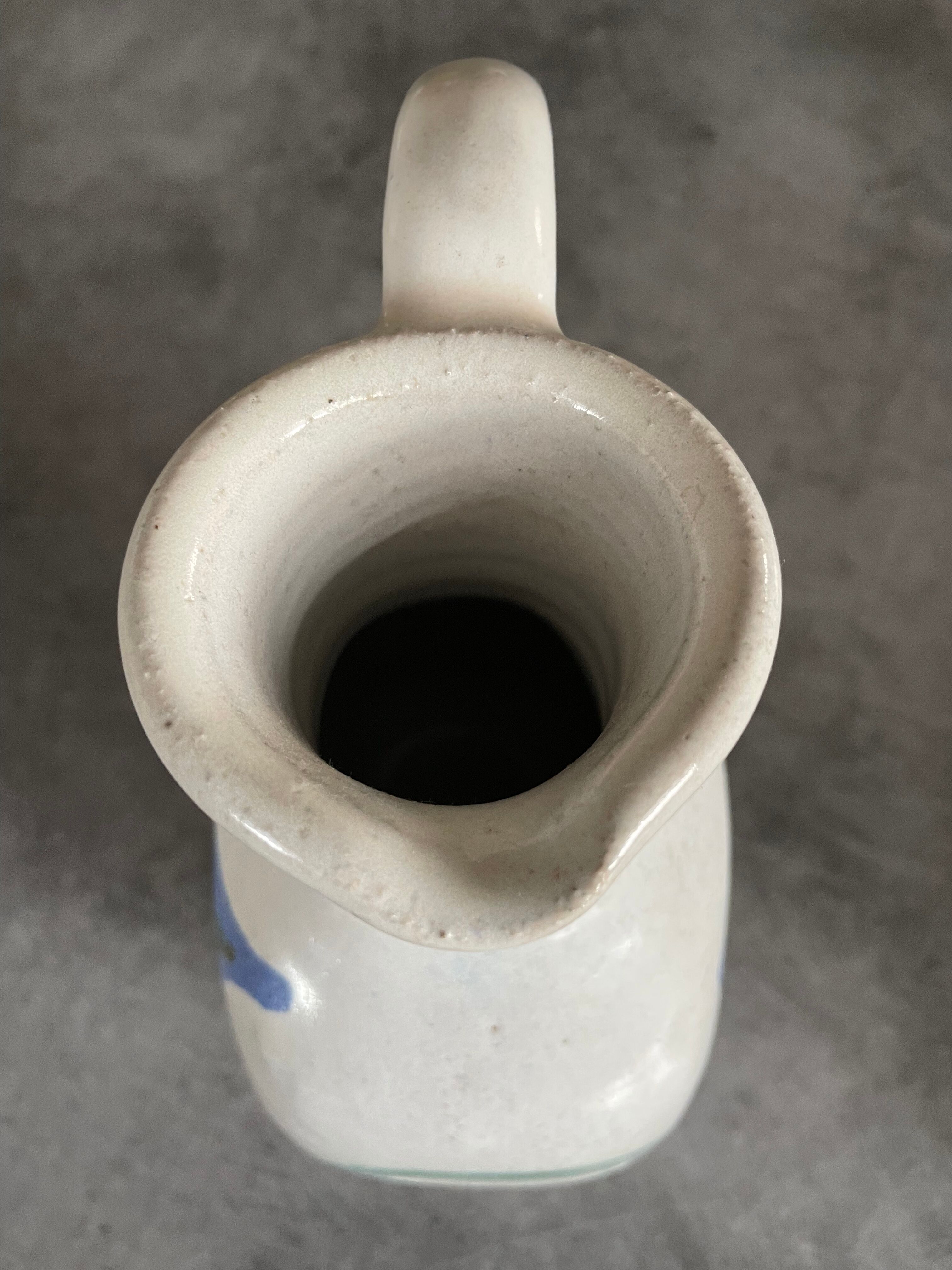 Vintage signed stoneware pitcher jug with floral painting decoration