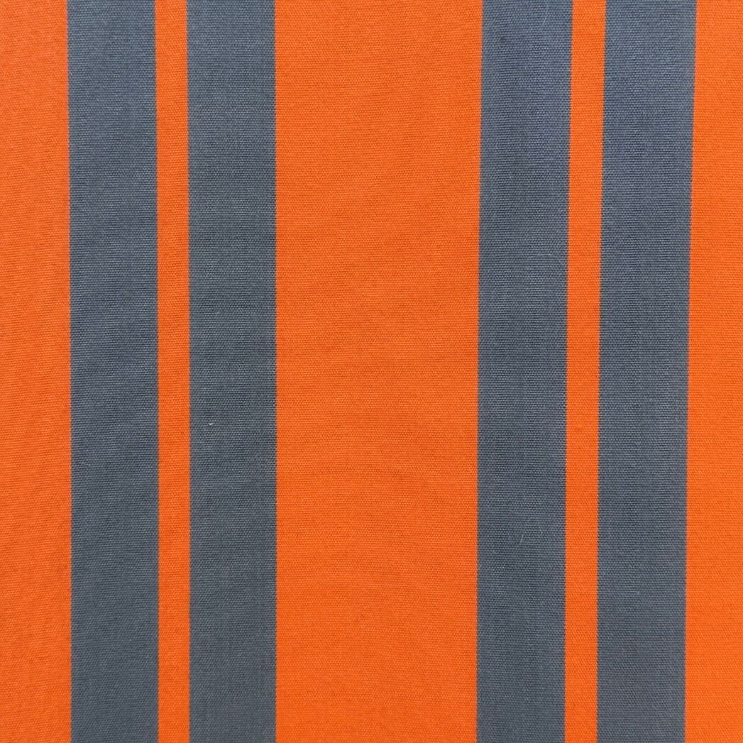 Vintage deck chair with orange and grey striped fabric, original patina.