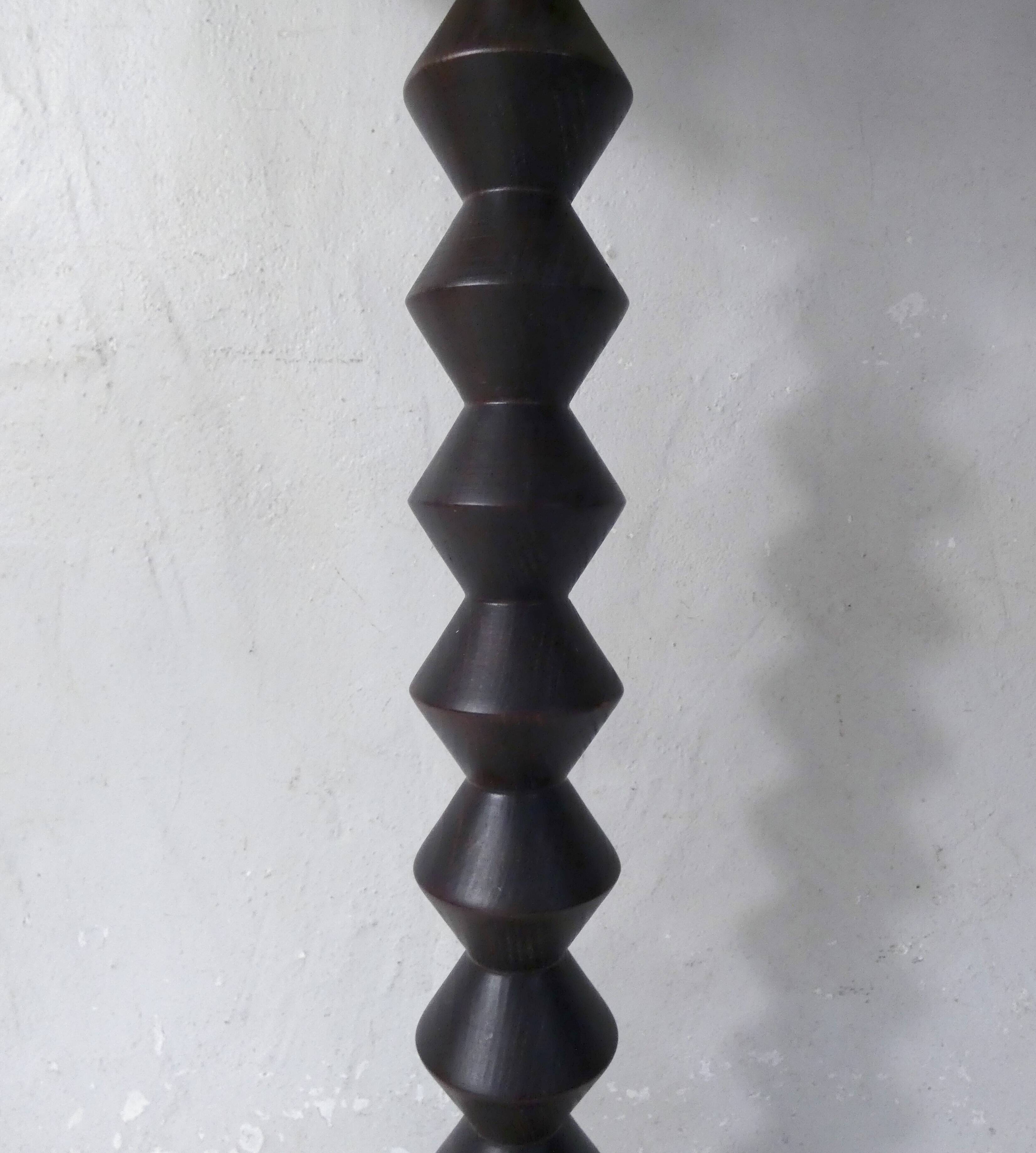 turned wooden lamp with spool base and vintage copper shade
