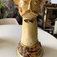 Terracotta plant holder head shape