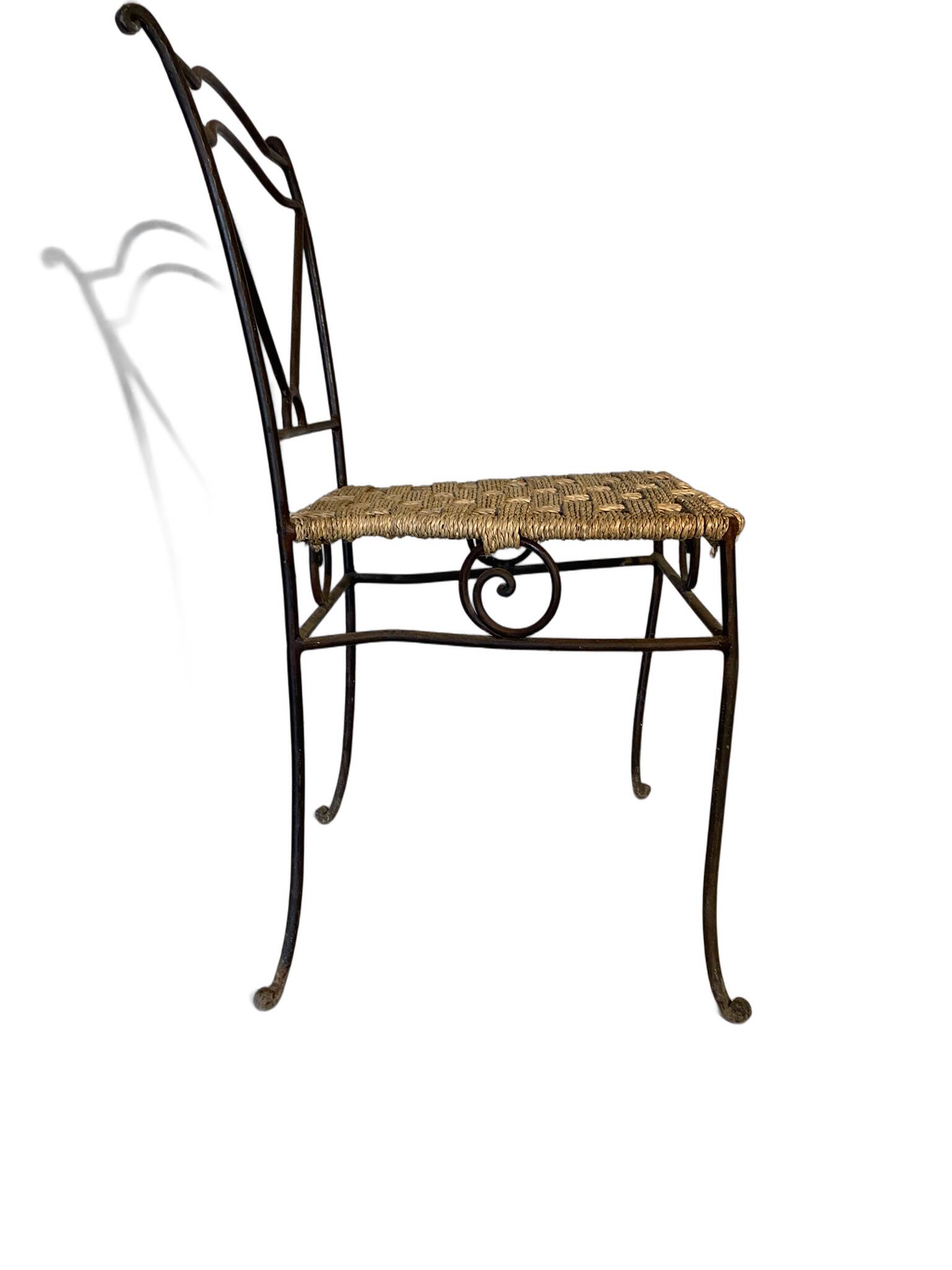 Wrought iron chair with woven seat