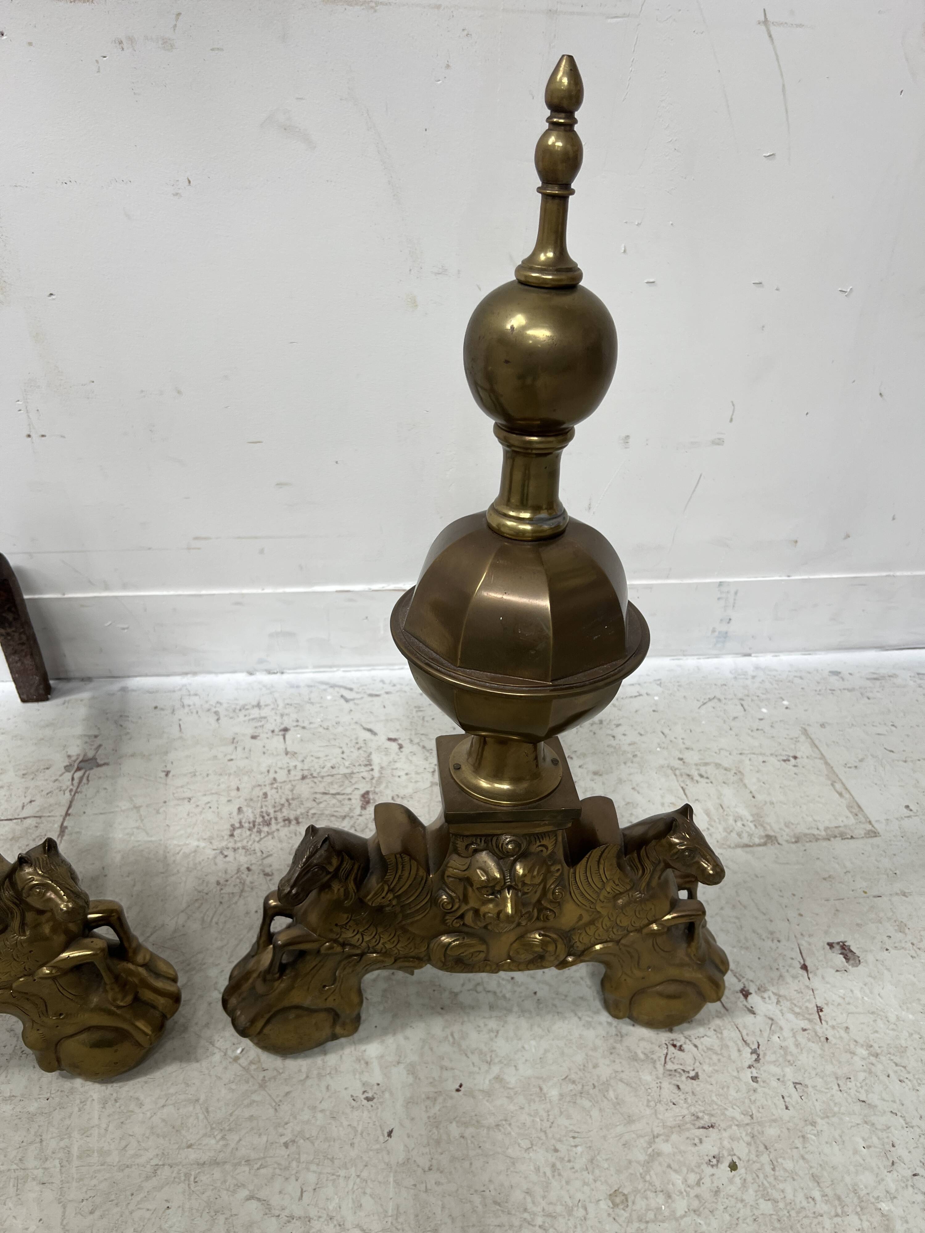 Important pair of brass log holders from the 20th century.