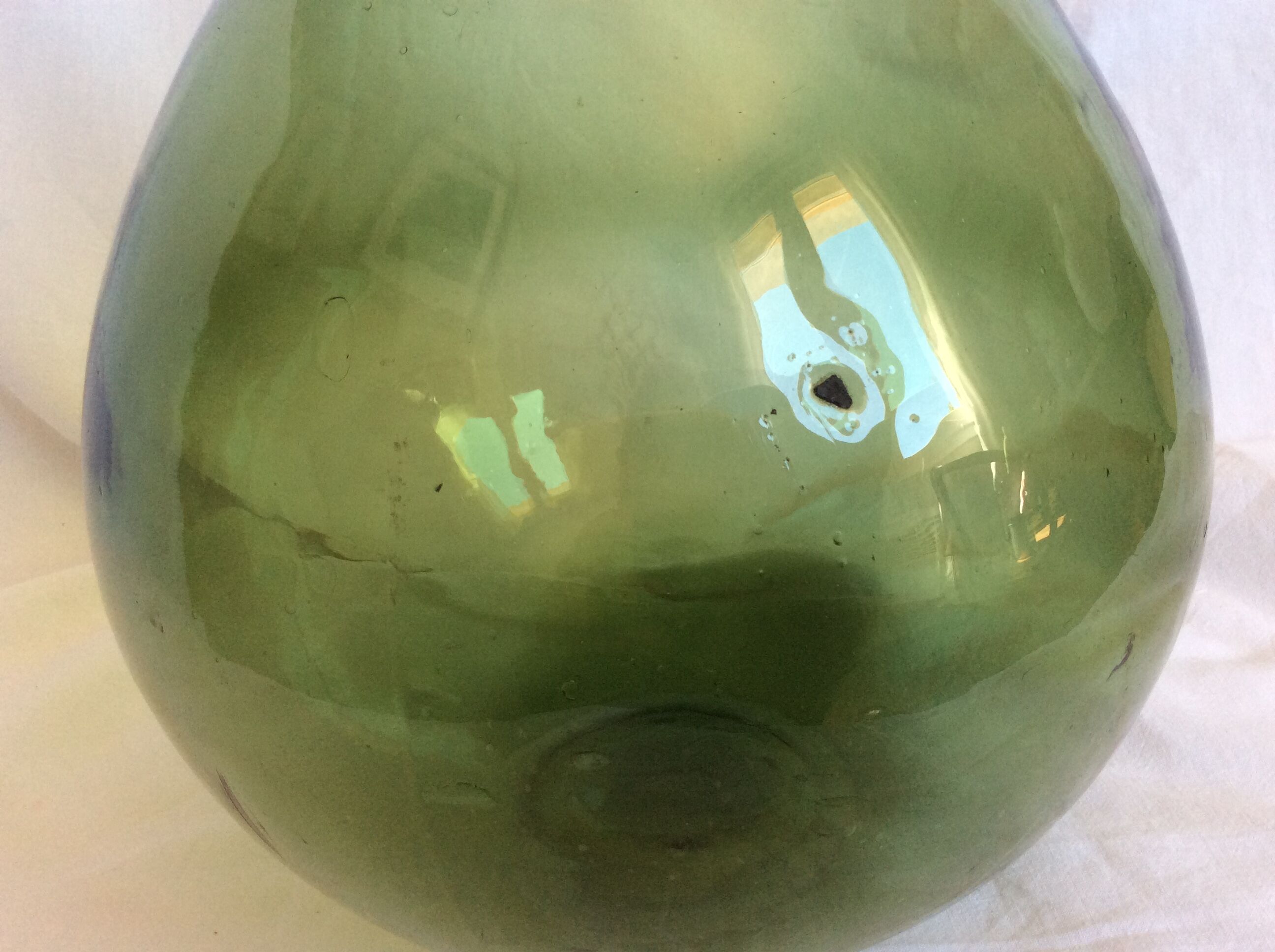 Former "lady jeanne" in blown glass, green bottle