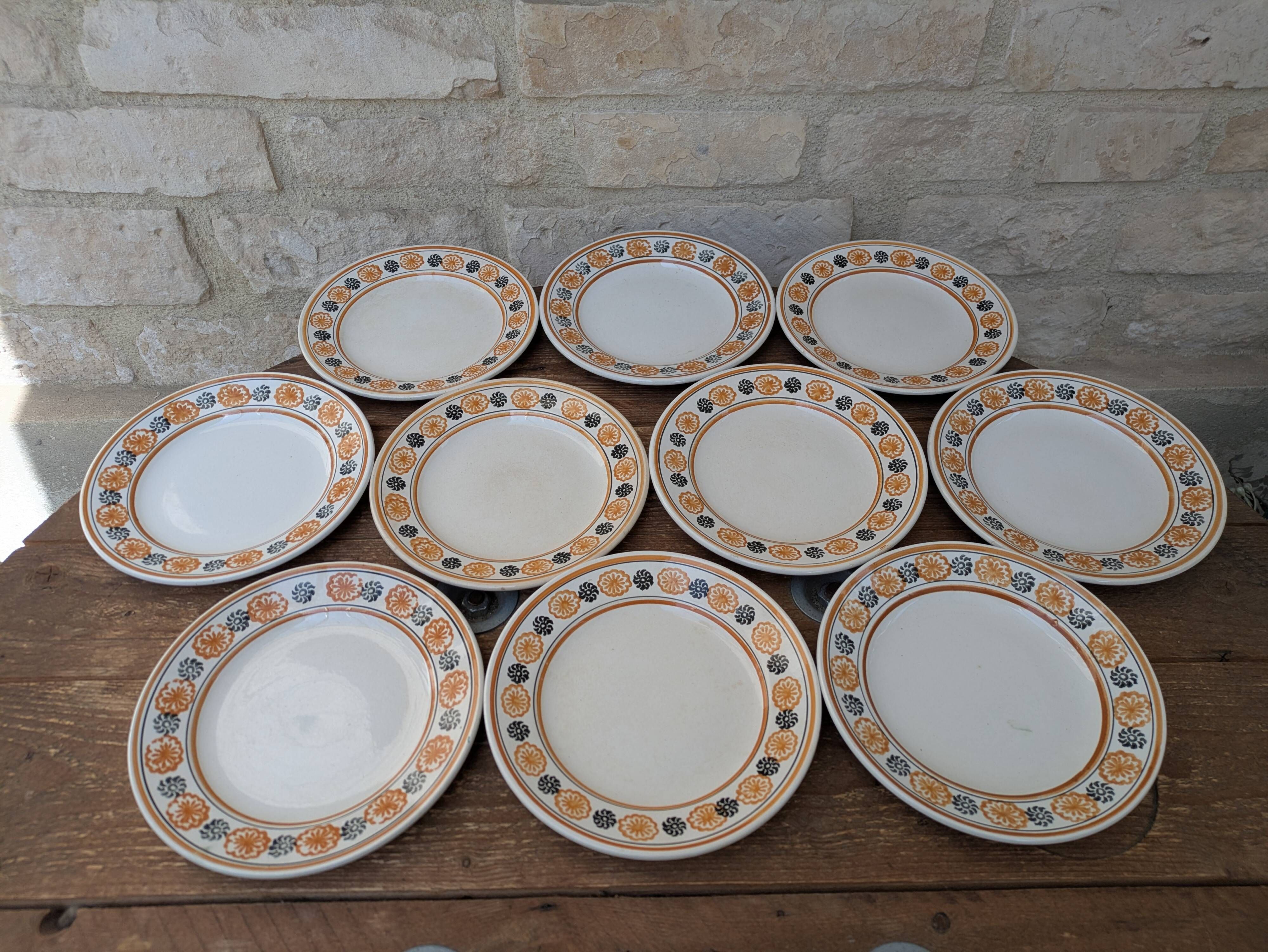10 dessert plates Saint Amand Amandinoise frilled with orange and black flowers.