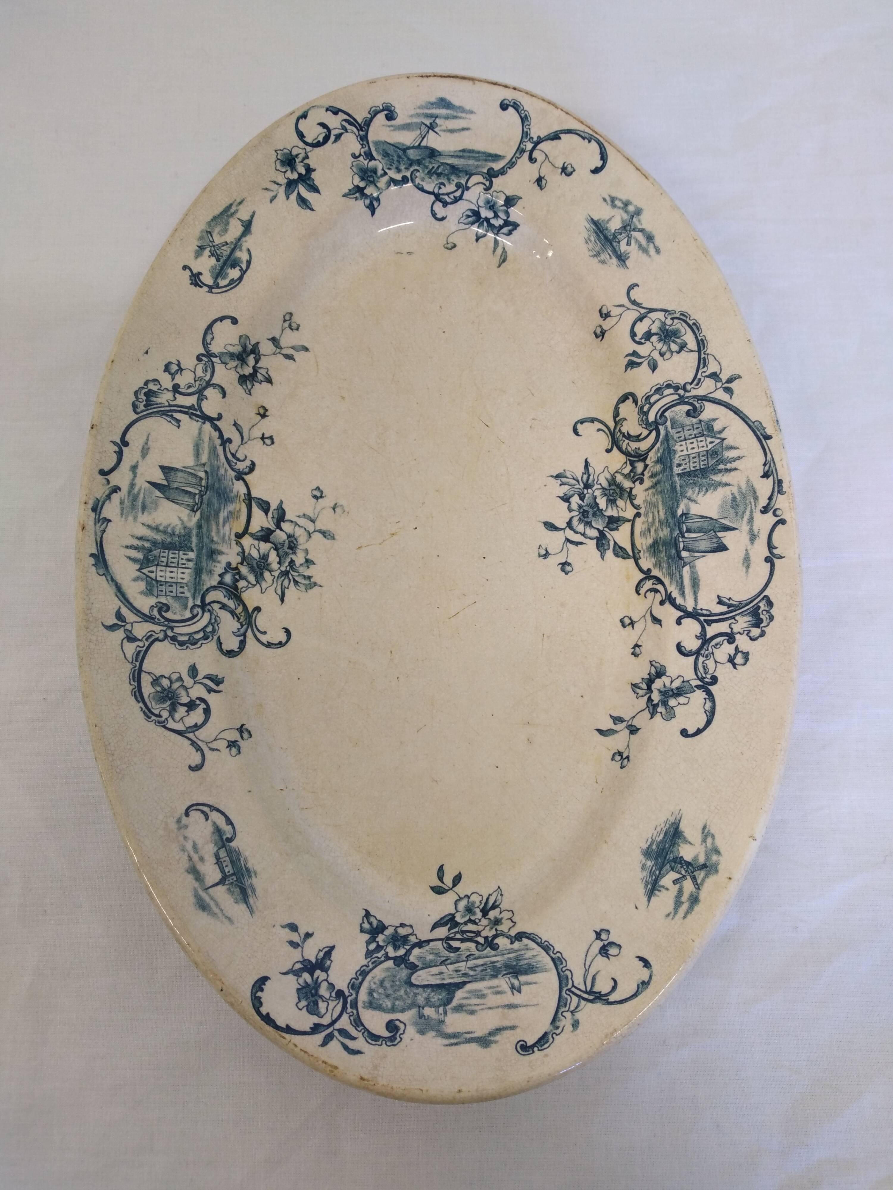 Old serving dish floral and maritime decoration