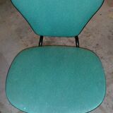 Chair in curved wood covered with vinyl, metal tube.