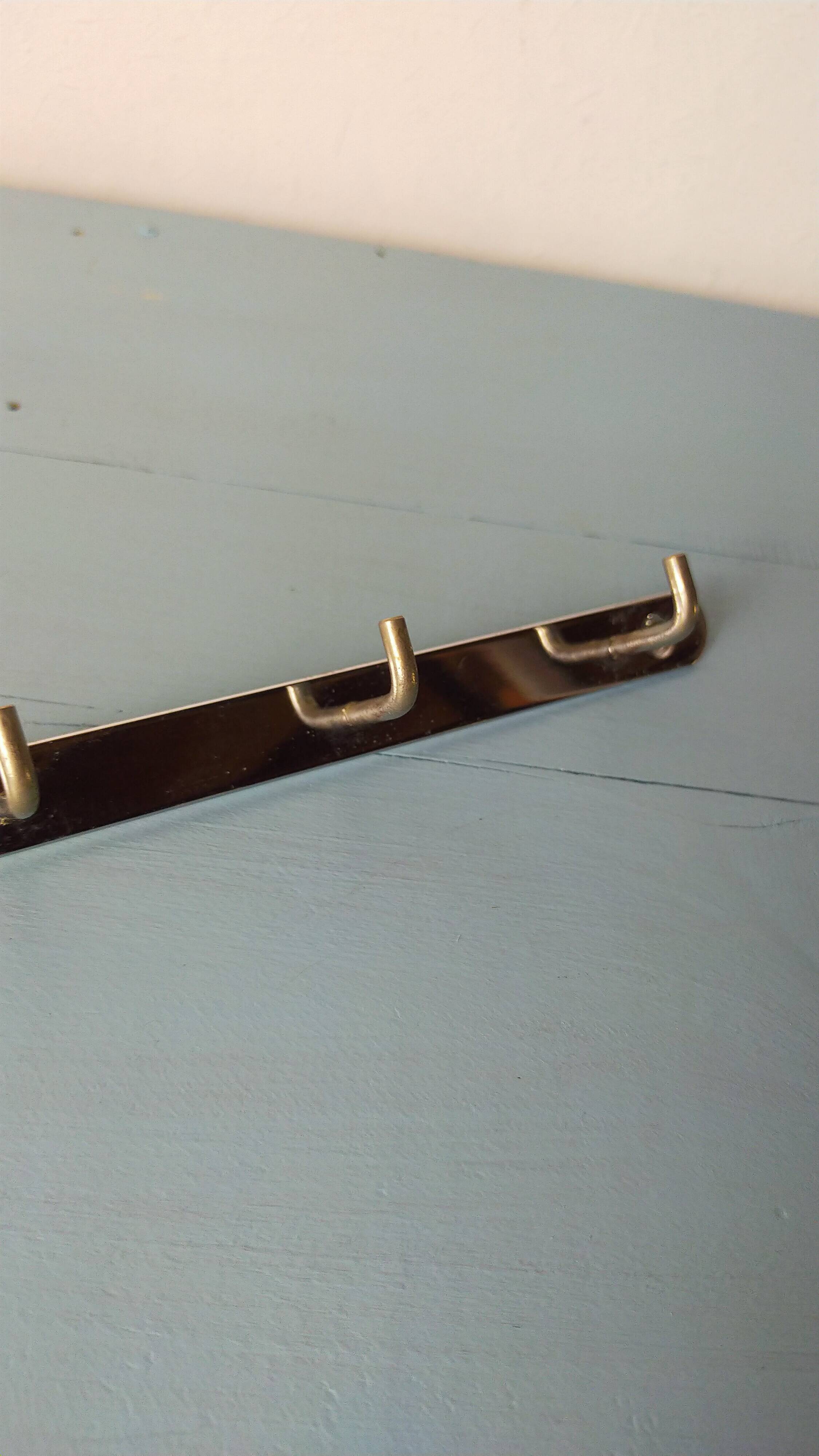 Two chrome tea towel hooks