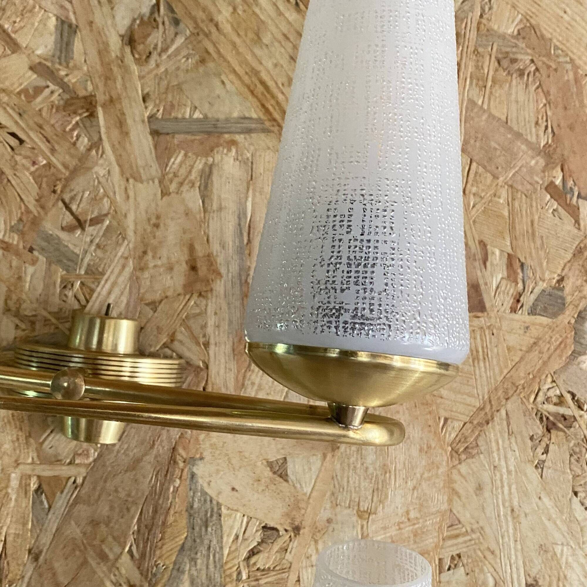 Pair of vintage double wall lights in brass with white ribbed glass tulips.