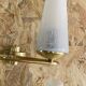 Pair of vintage double wall lights in brass with white ribbed glass tulips.