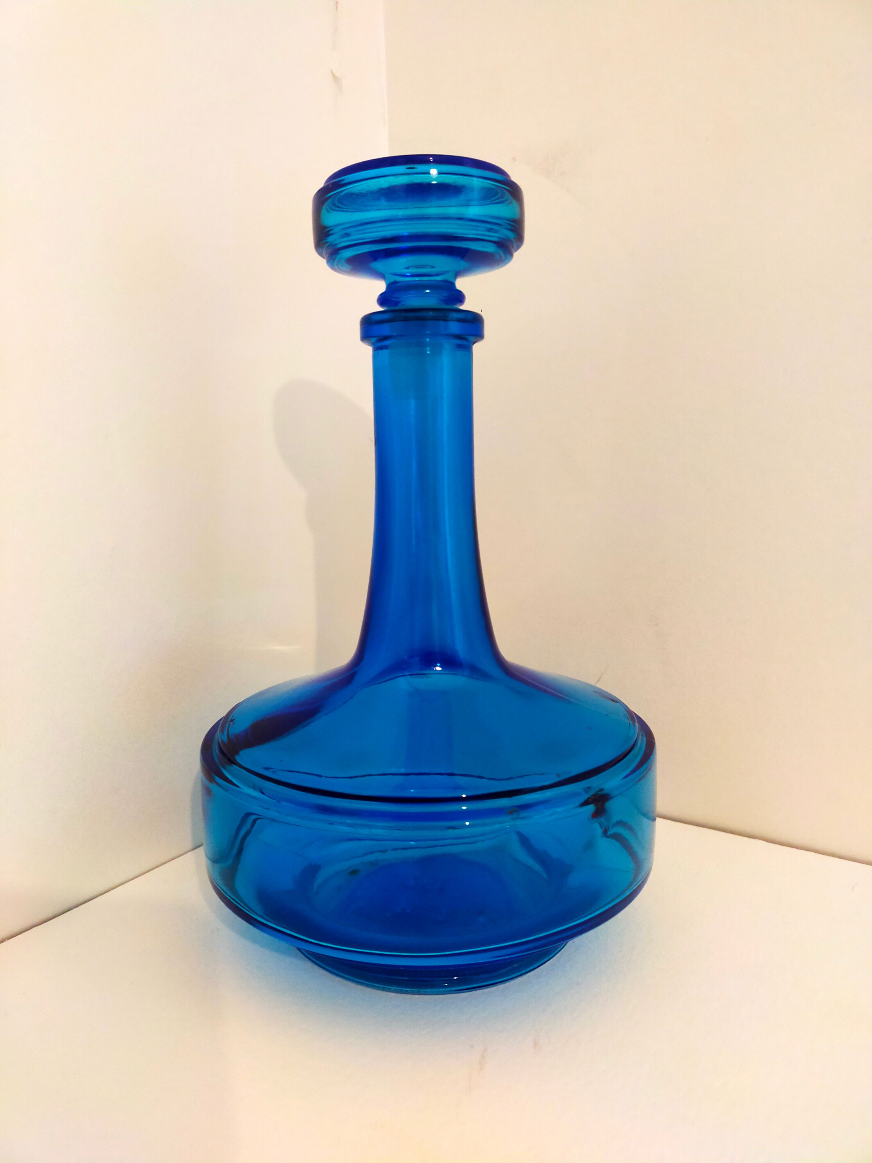Bottle of old perfume of blue color