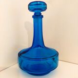 Bottle of old perfume of blue color