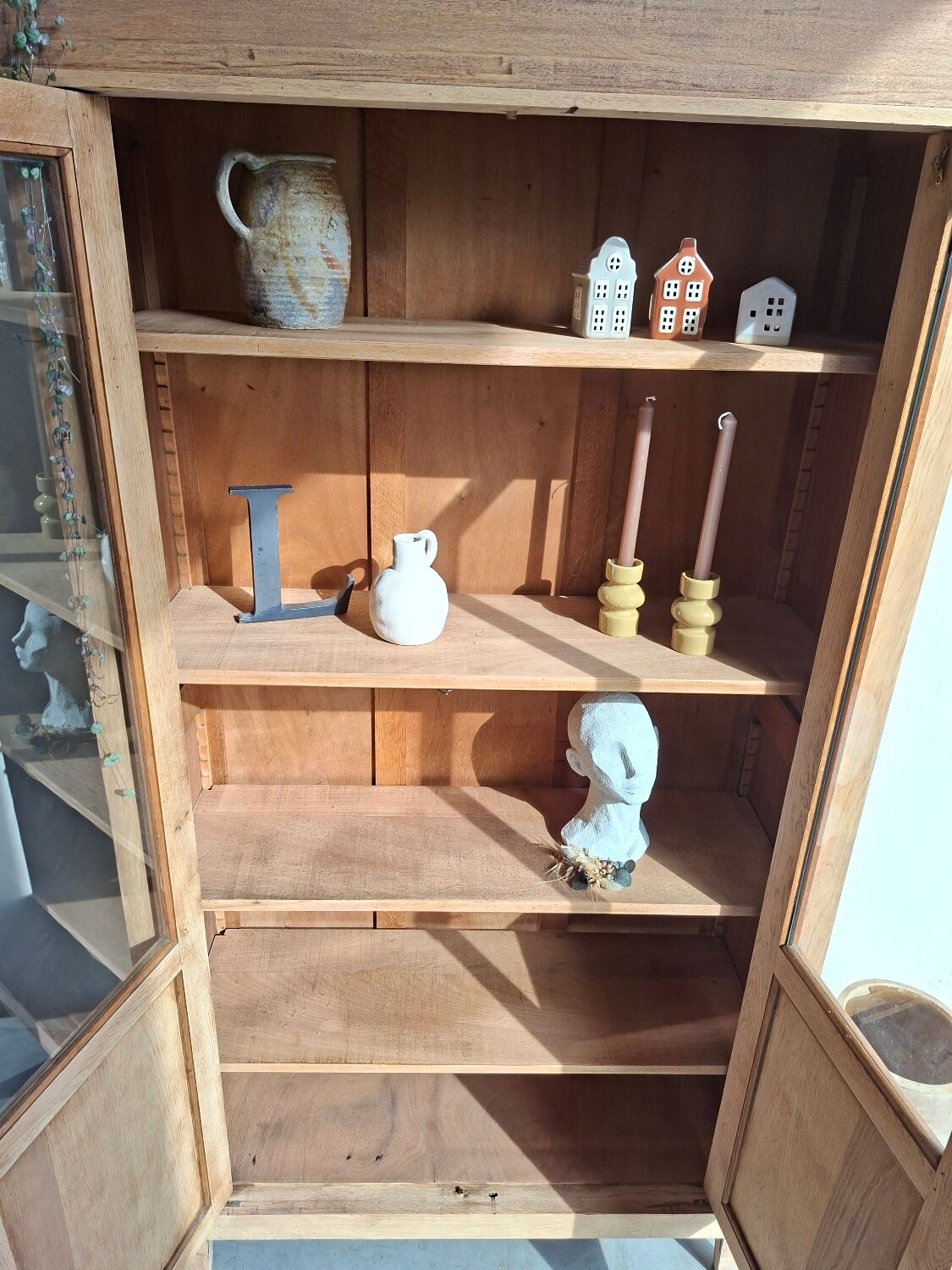 Large antique display cabinet in patinated solid oak.