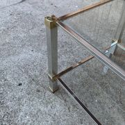 Vintage coffee table in brass and glass, with gold chrome accents — Pierre Vandel, Paris 1970s