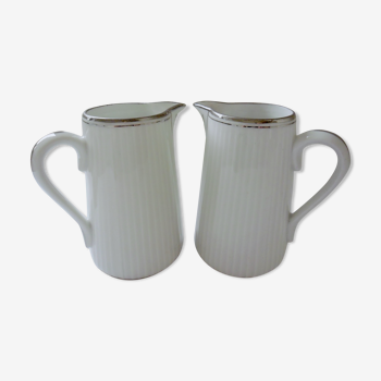 Pair of creamers in white porcelain enhanced with platinum