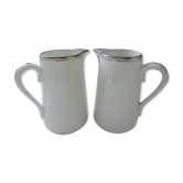 Pair of creamers in white porcelain enhanced with platinum