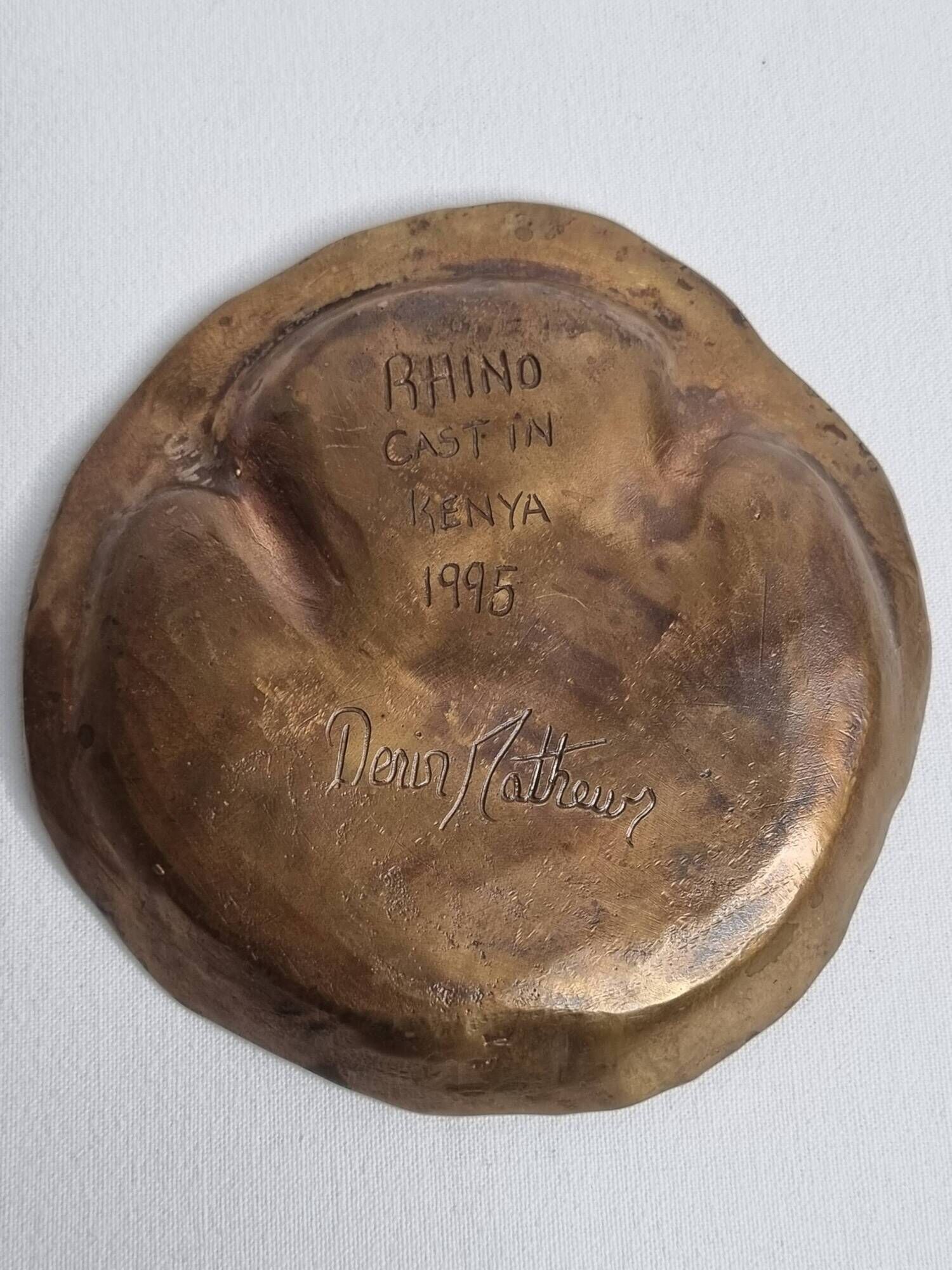 Bronze pocket emptier by Denis Mathews (1913-1997), "Rhinoceros Footprint" (12 cm), 1995