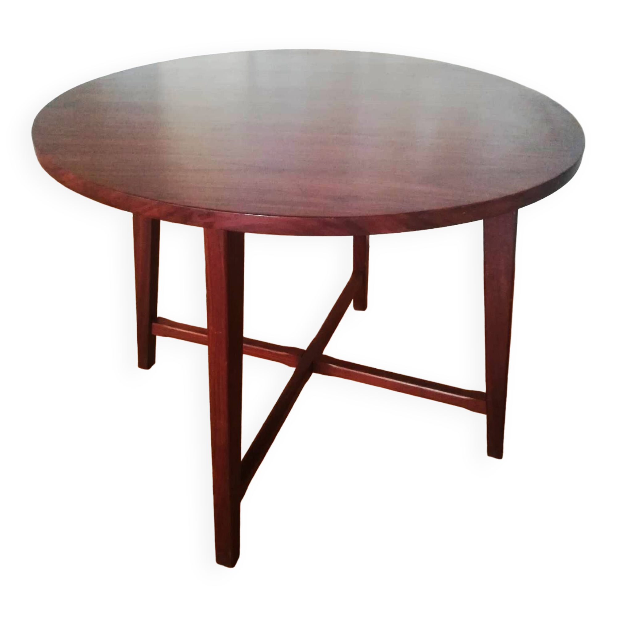 Round wooden table with thin legs
