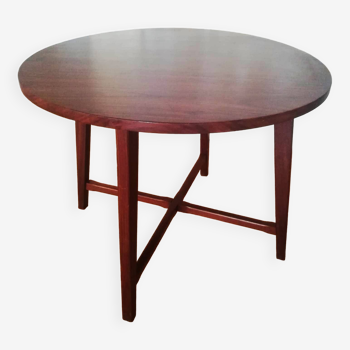 Round wooden table with thin legs