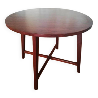 Round wooden table with thin legs