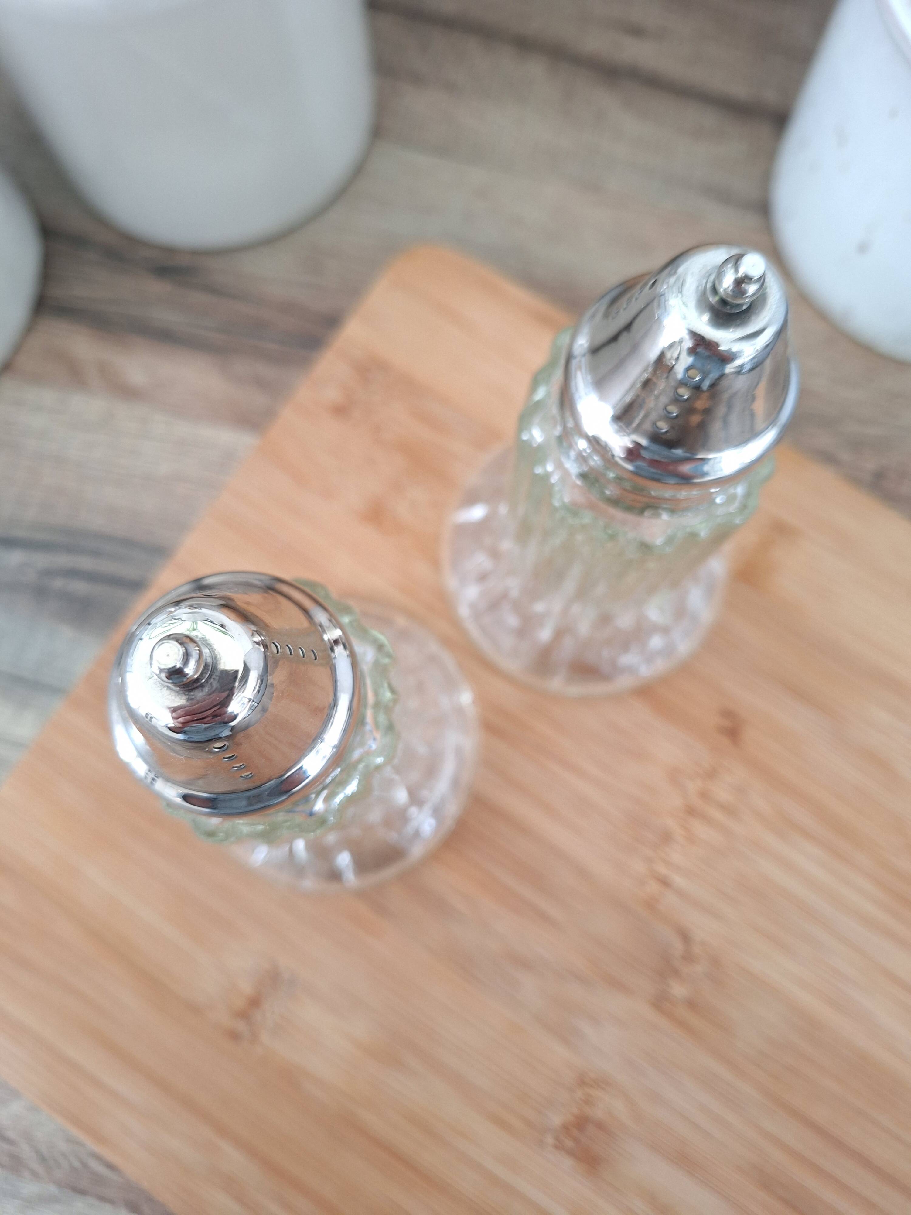 Glass and metal salt and pepper shakers